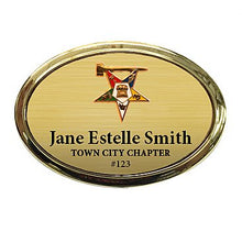 Load image into Gallery viewer, 1.5x2.5 Oval Badge with Gold Frame, with Clutch, Pin, or Magnet Back with Cast Emblem
